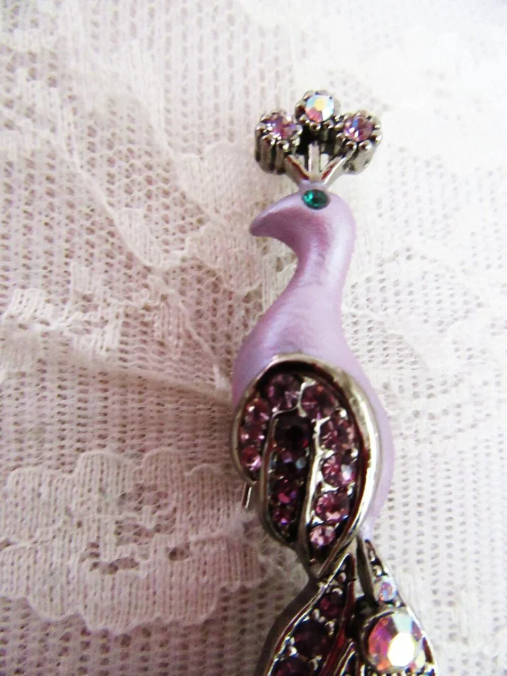 Peacock brooch with purple and aurora borealis rhinestones in silver setting
